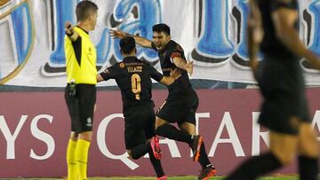 Argentina's Independiente Silvio Romero (R) celebrates with Argentina's Independiente Alan Velasco after scoring against Argentina's Tucuman during their closed-door Copa Sudamericana second round football match at the CA Tucuman stadium in