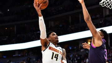 Gary Harris lanza ante Karl-Anthony Towns durante el Denver Nuggets-Minnesota Timberwolves.