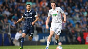 BOCHUM, GERMANY - APRIL 24: Anthony Losilla of VfL Bochum marks Michael Gregoritsch of FC Augsburg during the Bundesliga match between VfL Bochum and FC Augsburg at Vonovia Ruhrstadion on April 24, 2022 in Bochum, Germany. (Photo by Frederic Scheidemann/G