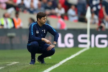 Pochettino looks on during Spurs' defeat to United at Wembley.