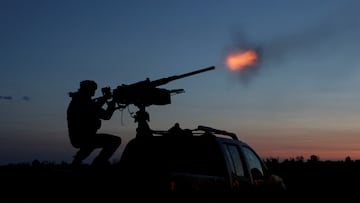 A serviceman from the mobile air defence unit of the 115th Separate Mechanized Brigade of the Ukrainian Armed Forces fires a Browning machine gun towards a Russian drone during an overnight shift, amid Russia's attack on Ukraine, in Kharkiv Region, Ukraine June 2, 2025. REUTERS/Sofiia Gatilova