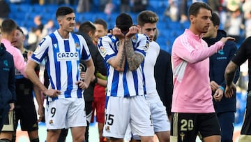 Real Sociedad's Spanish forward Carlos Fernandez (L) and Real Sociedad's Spanish defender Diego Rico (C) react at the end of the Spanish League football match between Real Sociedad and RC Celta de Vigo at the Reale Arena stadium in San Sebastian, on February 18, 2023. (Photo by ANDER GILLENEA / AFP) (Photo by ANDER GILLENEA/AFP via Getty Images)
