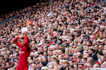 FILED - 21 August 2021, United Kingdom, Liverpool: Fans watch the action from the stands during the English Premier League soccer match between Liverpool and Burnley at Anfield. Photo: Mike Egerton/PA Wire/dpa