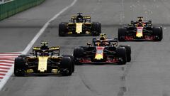 BAKU, AZERBAIJAN - APRIL 29:  Carlos Sainz of Spain driving the (55) Renault Sport Formula One Team RS18 leads Max Verstappen of the Netherlands driving the (33) Aston Martin Red Bull Racing RB14 TAG Heuer on track during the Azerbaijan Formula One Grand 