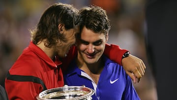 MELBOURNE, AUSTRALIA - FEBRUARY 01: Rafael Nadal of Spain consoles Roger Federer of Switzerland during the trophy presentation after his men's final match during day fourteen of the 2009 Australian Open at Melbourne Park on February 1, 2009 in Melbourne, Australia. (Photo by Scott Barbour/Getty Images)