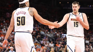 PHOENIX, ARIZONA - MAY 11: Nikola Jokic #15 of the Denver Nuggets high fives Aaron Gordon #50 during the second quarter in game six of the Western Conference Semifinal Playoffs against the Phoenix Suns at Footprint Center on May 11, 2023 in Phoenix, Arizona. NOTE TO USER: User expressly acknowledges and agrees that, by downloading and or using this photograph, User is consenting to the terms and conditions of the Getty Images License Agreement.   Christian Petersen/Getty Images/AFP (Photo by Christian Petersen / GETTY IMAGES NORTH AMERICA / Getty Images via AFP)