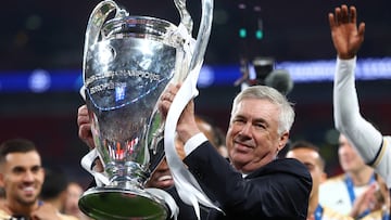 FILE PHOTO: Soccer Football - Champions League - Final - Borussia Dortmund v Real Madrid - Wembley Stadium, London, Britain - June 1, 2024 Real Madrid coach Carlo Ancelotti celebrates with the trophy after winning the Champions League REUTERS/Carl Recine/File Photo