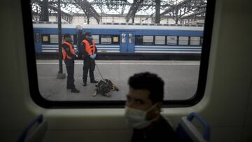 Police guard a train station during a government-ordered lockdown to curb the spread of the new coronavirus, in Buenos Aires, Argentina, Friday, April 24, 2020. (AP Photo/Natacha Pisarenko)