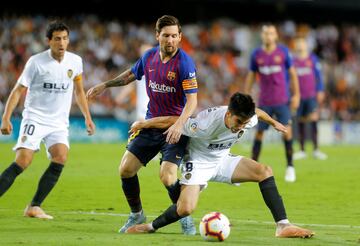 Leo Messi y Carlos Soler.