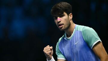 Spain's Carlos Alcaraz reacts during his match against Germany's Alexander Zverev at the ATP Finals tennis tournament in Turin on November 15, 2024. (Photo by Marco BERTORELLO / AFP)