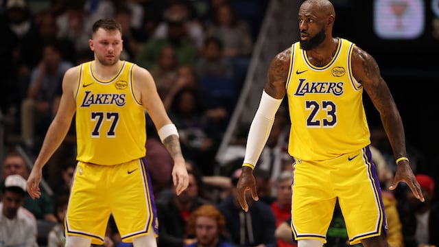 NEW ORLEANS, LOUISIANA - JANUARY 06: LeBron James #23 of the Los Angeles Lakers and Luka Doncic #77 of the Los Angeles Lakers look on during the game against the New Orleans Pelicans at Smoothie King Center on January 06, 2026 in New Orleans, Louisiana. NOTE TO USER: User expressly acknowledges and agrees that, by downloading and or using this photograph, User is consenting to the terms and conditions of the Getty Images License Agreement. Chris Graythen/Getty Images/AFP (Photo by Chris Graythen / GETTY IMAGES NORTH AMERICA / Getty Images via AFP)
