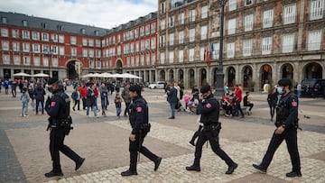 Police intervene to prevent clashes between Chelsea and Manchester City fans in the centre of Madrid