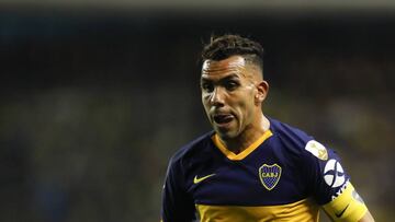 Carlos Tevez of Argentina's Boca Juniors goes for the ball during a quarter final second leg Copa Libertadores soccer match against Ecuador's Liga Deportiva Universitaria in Buenos Aires, Argentina, Wednesday, Aug. 28, 2019. (AP Photo/Natacha Pisarenko)