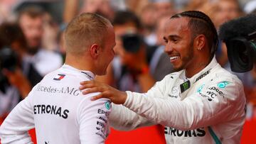 HOCKENHEIM, GERMANY - JULY 22:  Race winner Lewis Hamilton of Great Britain and Mercedes GP hugs second placed Valtteri Bottas of Finland and Mercedes GP in parc ferme during the Formula One Grand Prix of Germany at Hockenheimring on July 22, 2018 in Hockenheim, Germany.  (Photo by Dan Istitene/Getty Images)