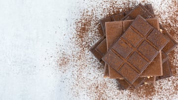 Stack of chocolate bars decorated with cocoa powder. High quality photo