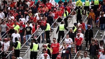 Manchester United fans leave Wembley Stadium in London after the FA Cup final football match between Manchester City and Manchester United on June 3, 2023. Manchester City beat Manchester United 2-1 at Wembley to keep their treble dream alive. (Photo by HENRY NICHOLLS / AFP)