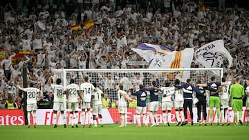 Real Madrid's celebrate victory with supporters at the end of the Spanish league football match between Real Madrid CF and FC Barcelona at the Santiago Bernabeu stadium in Madrid on April 21, 2024. Real Madrid won 3-2. (Photo by JAVIER SORIANO / AFP)