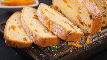 Orange cake with dried apricots and powdered sugar.