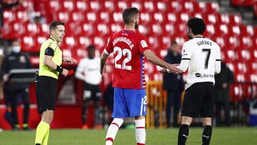 GRANADA, SPAIN - DECEMBER 30: Goncalo Guedes of Valencia CF is shown a red card by Referee Adrian Cordero Vega during the La Liga Santander match between Granada CF and Valencia CF at Estadio Nuevo Los Carmenes on December 30, 2020 in Granada, Spain. Spor
