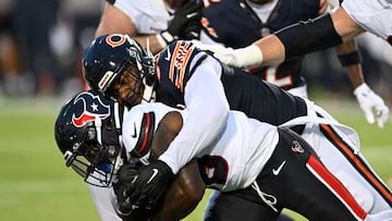 CANTON, OHIO - AUGUST 01: Byron Cowart #93 of the Chicago Bears tackles J.J. Taylor #38 of the Houston Texans during the first half of the 2024 Pro Football Hall of Fame Game at Tom Benson Hall Of Fame Stadium on August 01, 2024 in Canton, Ohio. Nick Cammett/Getty Images/AFP (Photo by Nick Cammett / GETTY IMAGES NORTH AMERICA / Getty Images via AFP)