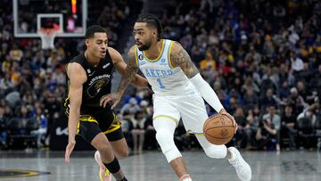 D'Angelo Russell #0 of the Los Angeles Lakers dribbles past Jordan Poole #3 of the Golden State Warriors during the third quarter at Chase Center on February 11, 2023 in San Francisco, California.