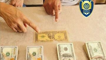 Detienen a dos hombres que intentaban vender un billete de un mill車n de d車lares