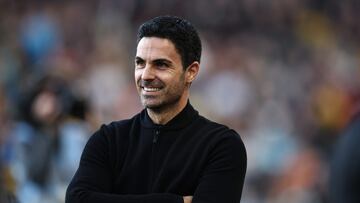 Arsenal's Spanish manager Mikel Arteta smiles ahead of kick-off in the English Premier League football match between Wolverhampton Wanderers and Arsenal at the Molineux stadium in Wolverhampton, central England on April 20, 2024. (Photo by HENRY NICHOLLS / AFP) / RESTRICTED TO EDITORIAL USE. No use with unauthorized audio, video, data, fixture lists, club/league logos or 'live' services. Online in-match use limited to 120 images. An additional 40 images may be used in extra time. No video emulation. Social media in-match use limited to 120 images. An additional 40 images may be used in extra time. No use in betting publications, games or single club/league/player publications. / 