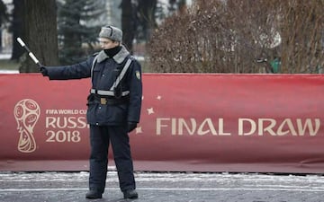 An Interior Ministry officer controls traffic near the Kremlin before the events, dedicated to the upcoming Final Draw of the 2018 FIFA World Cup Russia, in central Moscow, Russia November 29, 2017