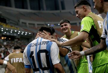 Claudio Echeverri celebrates with teammates after scoring his second goal against Brazil.