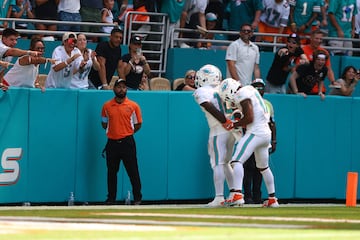 Tyreek Hill and Jaylen Waddle of the Miami Dolphins celebrate after Hill's touchdown against the Jacksonville Jaguars.