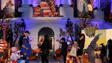 U.S. President Joe Biden and first lady Jill Biden give out books and candy to children for a Halloween celebration at the White House in Washington, U.S., October 30, 2023. REUTERS/Leah Millis