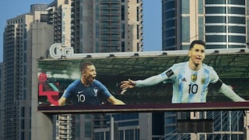 A billboard with pictures of France's striker Kylian Mbappe (L) and Argentine's captain Lionel Messi is displayed in Doha on November 8, 2022, ahead of the Qatar 2022 FIFA World Cup football tournament. (Photo by GABRIEL BOUYS / AFP) (Photo by GABRIEL BOUYS/AFP via Getty Images)