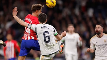 Atletico Madrid's Spanish midfielder #14 Marcos Llorente scores the equalizing goal during the Spanish league football match between Real Madrid CF and Club Atletico de Madrid at the Santiago Bernabeu stadium in Madrid on February 4, 2024. (Photo by OSCAR DEL POZO / AFP)