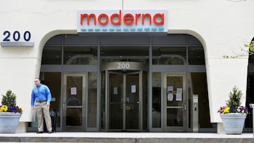 (FILES) In this file photo taken on May 18, 2020, a man stands outside Moderna headquarters in Cambridge, Massachusetts. - US biotech firm Moderna on November 16, 2020 announced its experimental vaccine against Covid-19 was 94.5 percent effective, marking a second major breakthrough in the vaccine hunt. (Photo by Joseph Prezioso / AFP)