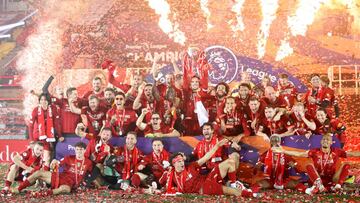 FILE PHOTO: Soccer Football - Premier League - Liverpool v Chelsea - Anfield, Liverpool, Britain - July 22, 2020 Liverpool&#039;s Jordan Henderson with teammates celebrates with the trophy after winning the Premier League Pool via REUTERS/Phil Noble EDITO