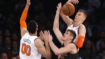 Dec 10, 2017; New York, NY, USA; New York Knicks forward Kristaps Porzingis (6) and center Enes Kanter (00) defend against Atlanta Hawks forward Ersan Ilyasova (7) during first half at Madison Square Garden. Mandatory Credit: Noah K. Murray-USA TODAY Sports