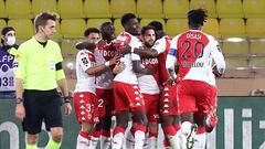 Monaco&#039;s Spanish midfielder Cesc Fabregas (C) celebrates with teammates after scoring a penalty kick during the French L1 football match between Monaco (ASM) and Paris Saint-Germain (PSG) at the Louis II Stadium in Monaco on November 20, 2020. (Photo