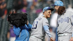 San Diego Padres third baseman Manny Machado (13) congratulates pitcher Matt Strahm after a baseball game against the Colorado Rockies, Sunday, June 16, 2019, in Denver. Strahm drew a bases-loaded walk as a pinch hitter to force in the go-ahead run in the Padres&#039; victory. (AP Photo/David Zalubowski)