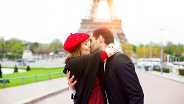 Young romantic couple kissing near the Eiffel Tower in Paris. Image taken during istockalypse Paris 2016