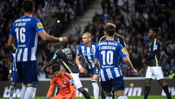 FC Porto's Portuguese defender Pepe (C) celebrates after scoring a goal during the Portuguese League football match between FC Porto and Portimonense SC at the Dragao stadium in Porto on April 16, 2022. (Photo by MIGUEL RIOPA / AFP)