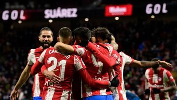 Atletico Madrid's players celebrate after Atletico Madrid's Uruguayan forward Luis Suarez scored a goal during the Spanish League football match between Club Atletico de Madrid and Deportivo Alaves at the Wanda Metropolitano stadium in Madrid on