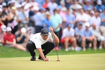 Xander Schauffele of the United States lines up a putt 