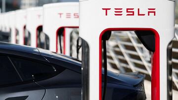 FILE PHOTO: The logo of Tesla is pictured at a Tesla Super Charging station in Saint-Herblain near Nantes, France, March 27, 2025. REUTERS/Stephane Mahe/File Photo