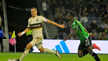 Sep 18, 2024; Los Angeles, California, USA; LAFC defender Aaron Long (33) controls the ball against Austin FC forward Osman Bukari (7) in the first half at BMO Stadium. Mandatory Credit: Jayne Kamin-Oncea-Imagn Images