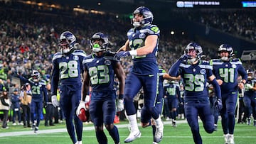 SEATTLE, WASHINGTON - JANUARY 25: Dareke Young #83 of the Seattle Seahawks celebrates with teammates after recovering a muffed punt during the third quarter against the Los Angeles Rams in the NFC Championship game at Lumen Field on January 25, 2026 in Seattle, Washington. Jane Gershovich/Getty Images/AFP (Photo by Jane Gershovich / GETTY IMAGES NORTH AMERICA / Getty Images via AFP)
