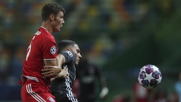 Bayern's Benjamin Pavard, left, and Lyon's Rayan Cherki fight for the ball during the Champions League semifinal soccer match between Lyon and Bayern Munich at the Jose Alvalade stadium in Lisbon, Portugal, Wednesday, Aug. 19, 2020. (Miguel A. L
