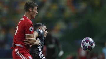 Bayern&#039;s Benjamin Pavard, left, and Lyon&#039;s Rayan Cherki fight for the ball during the Champions League semifinal soccer match between Lyon and Bayern Munich at the Jose Alvalade stadium in Lisbon, Portugal, Wednesday, Aug. 19, 2020. (Miguel A. L