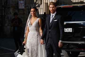 Husband and wife pose for the media after the ceremony.