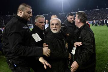 Paok president Ivan Savvidis is escorted away.