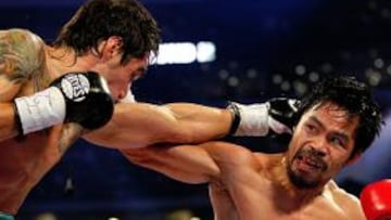 CONTUNDENTE. El boxeador filipino infligió un duro castigo al mexicano Margarito, que acabó con problemas de visión.